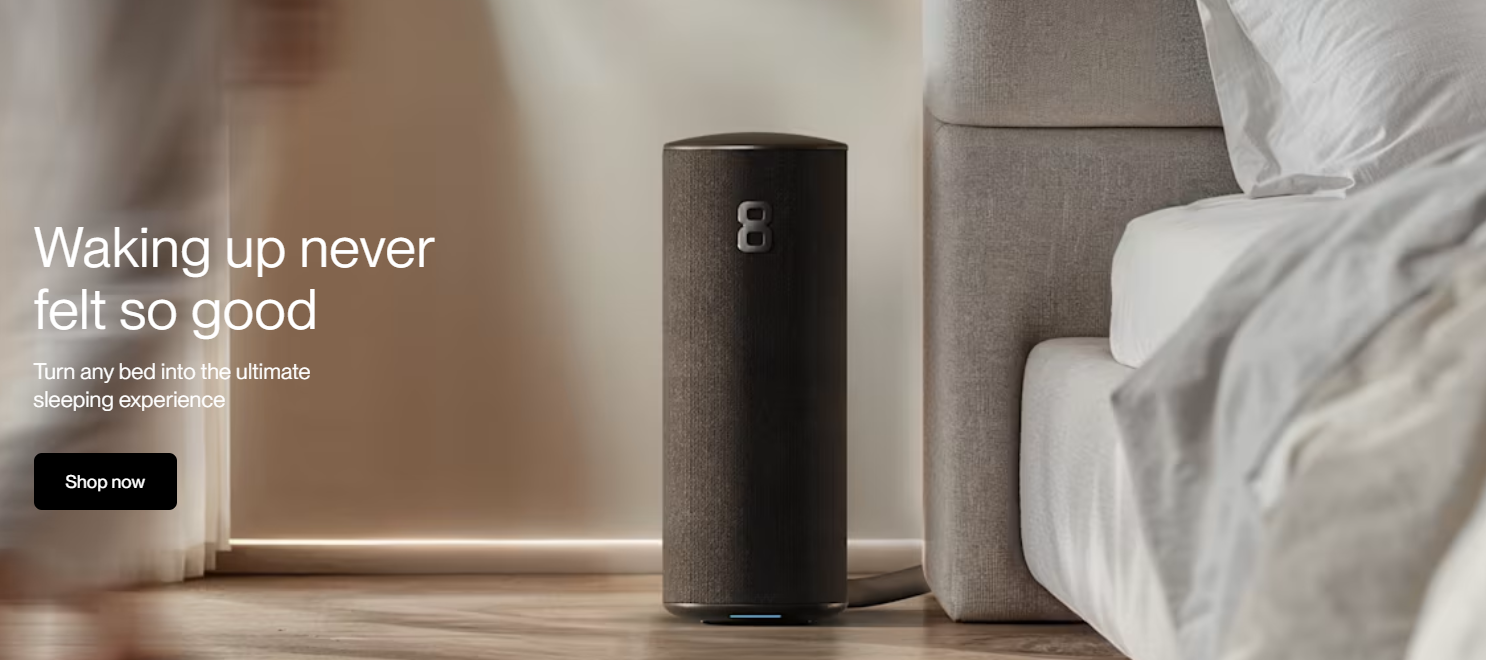 Eight-Sleep hub cylinder next to a bed.
